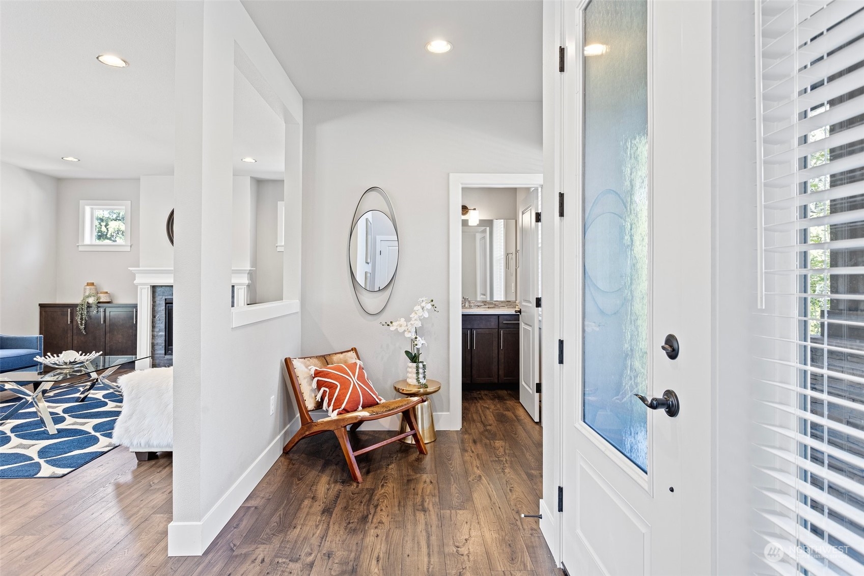 11317 Southeast 162nd Street Renton, WA 98055 - Photo 5 of 33 a living room with furniture a mirror and a wooden floor