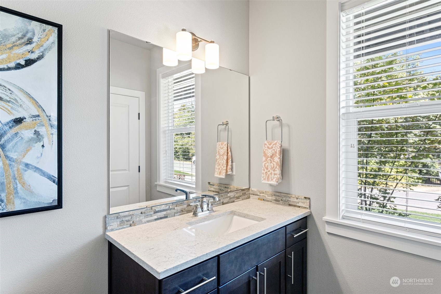 11317 Southeast 162nd Street Renton, WA 98055 - Photo 6 of 33 a bathroom with a sink and a mirror
