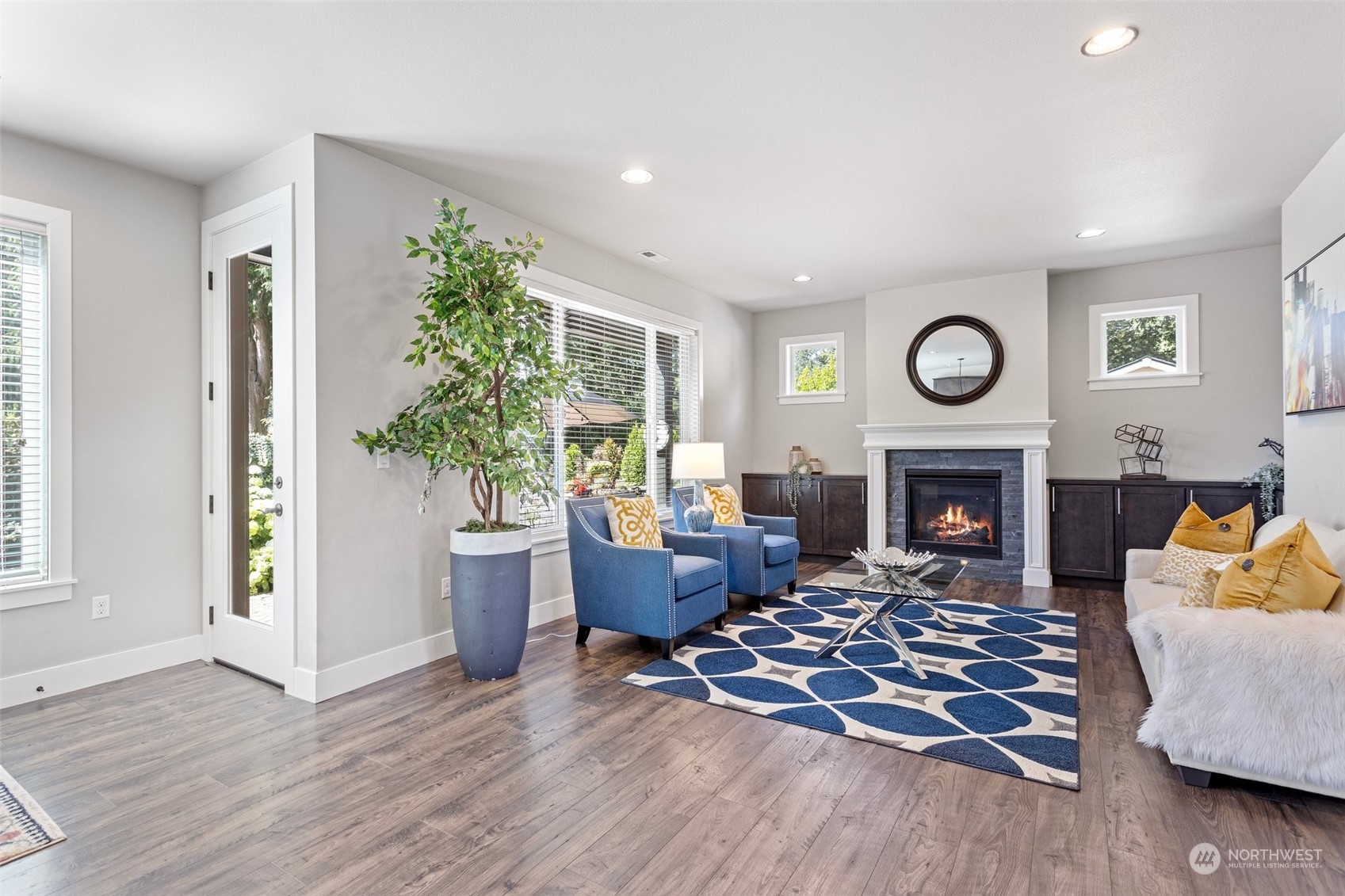 11317 Southeast 162nd Street Renton, WA 98055 - Photo 7 of 33 a living room with furniture and a fireplace
