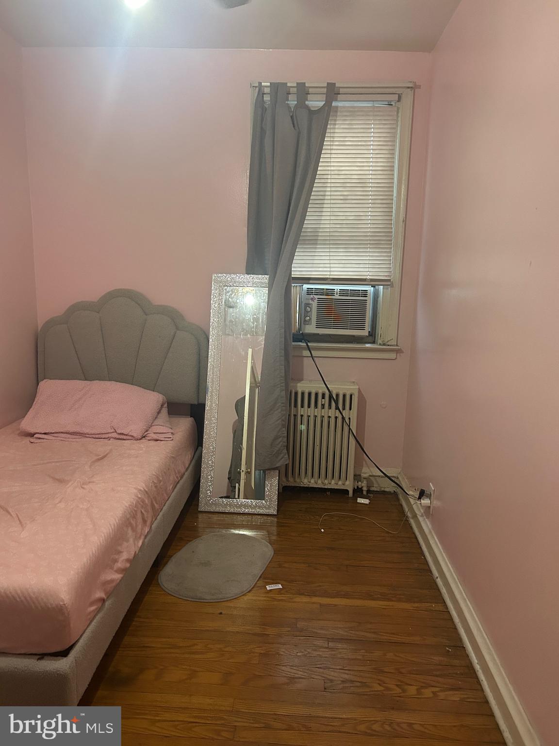 5331 Tabor Avenue Philadelphia, PA 19120 - Photo 8 of 18 a bedroom with a bed and a window