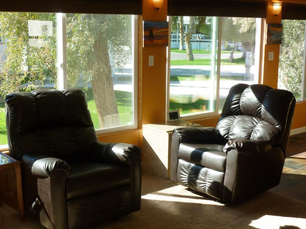 84136 Ave 44, Unit 58 Indio, CA 92203 - Photo 17 of 61 a living room with furniture and large windows