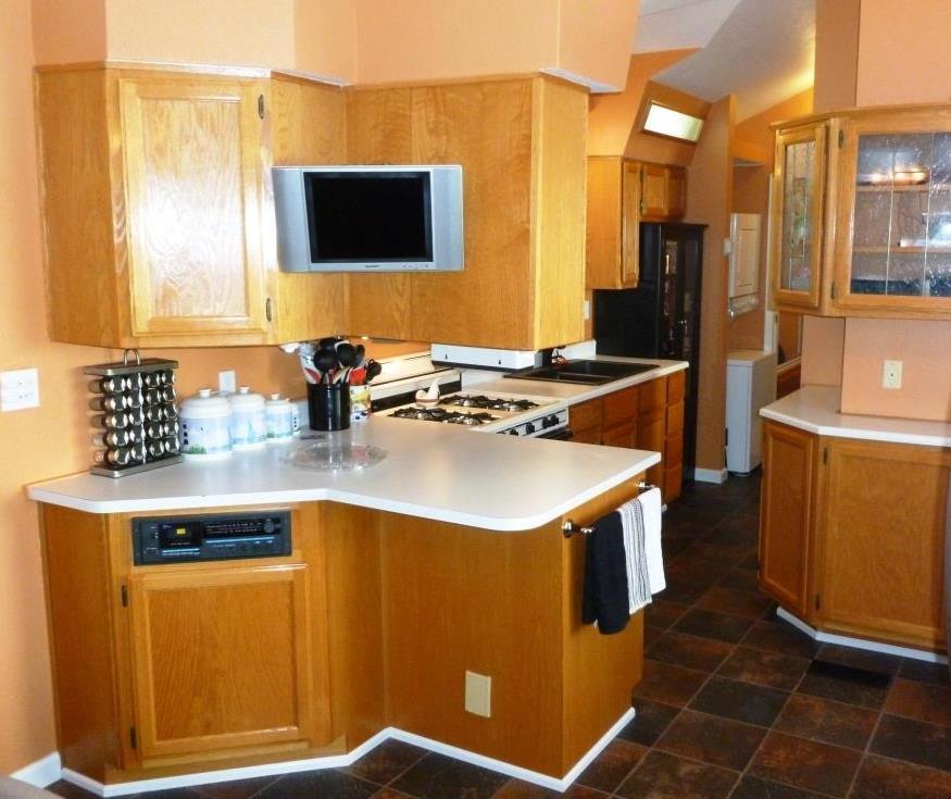 84136 Ave 44, Unit 58 Indio, CA 92203 - Photo 19 of 61 a kitchen with stainless steel appliances granite countertop a sink stove and refrigerator