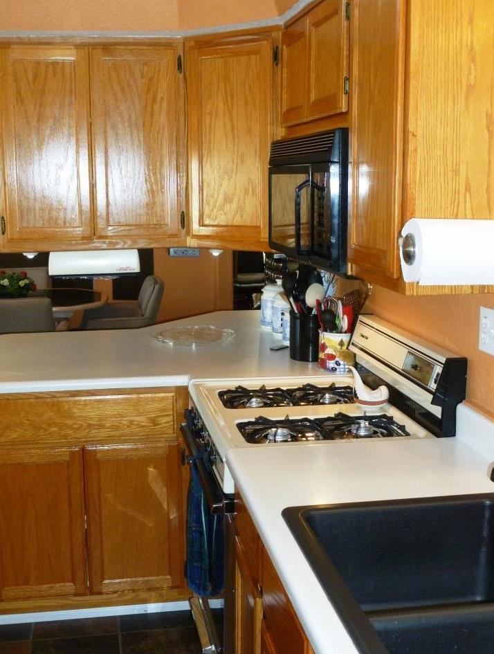 84136 Ave 44, Unit 58 Indio, CA 92203 - Photo 24 of 61 a kitchen with a stove and a refrigerator