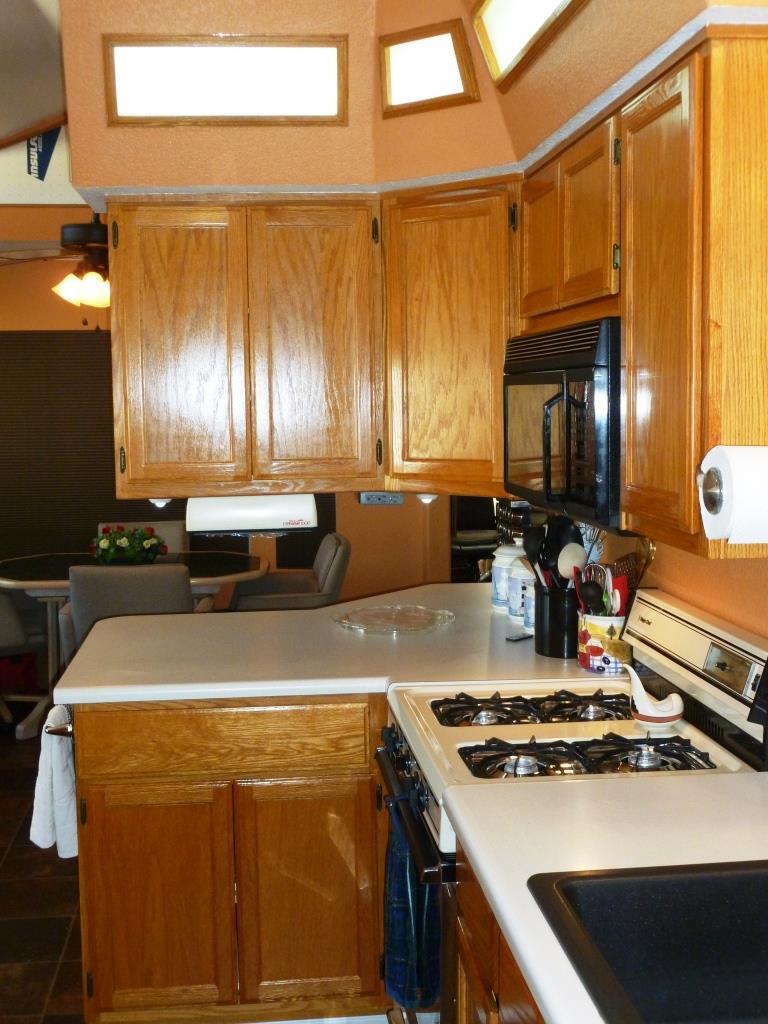 84136 Ave 44, Unit 58 Indio, CA 92203 - Photo 25 of 61 a kitchen with a stove and a sink