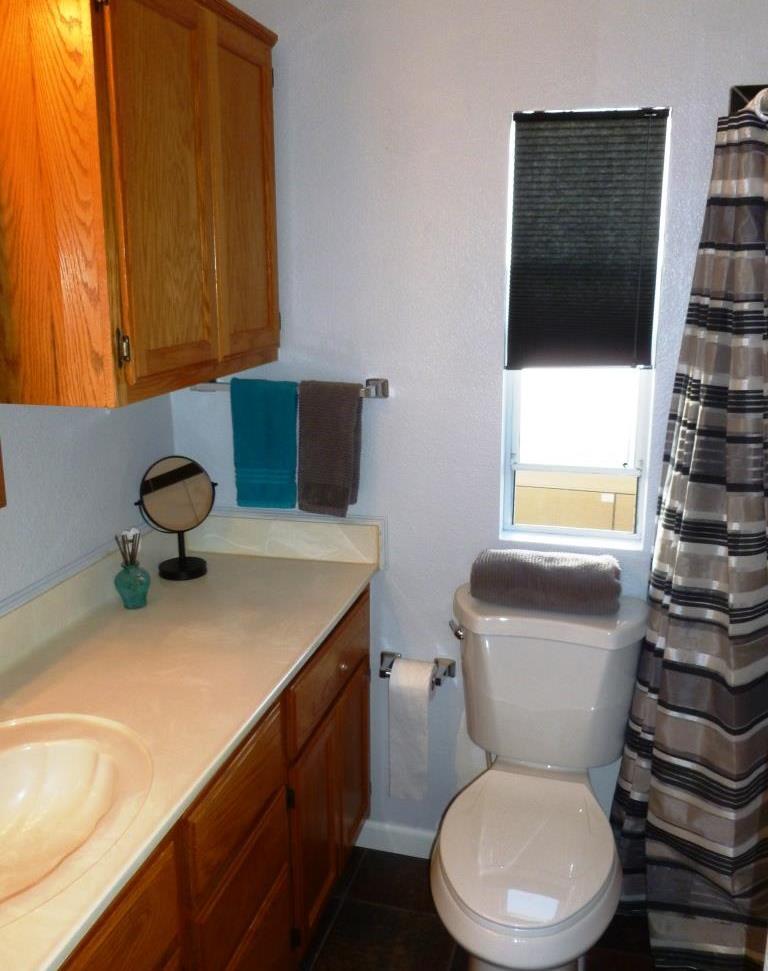 84136 Ave 44, Unit 58 Indio, CA 92203 - Photo 31 of 61 a bathroom with a toilet sink and mirror