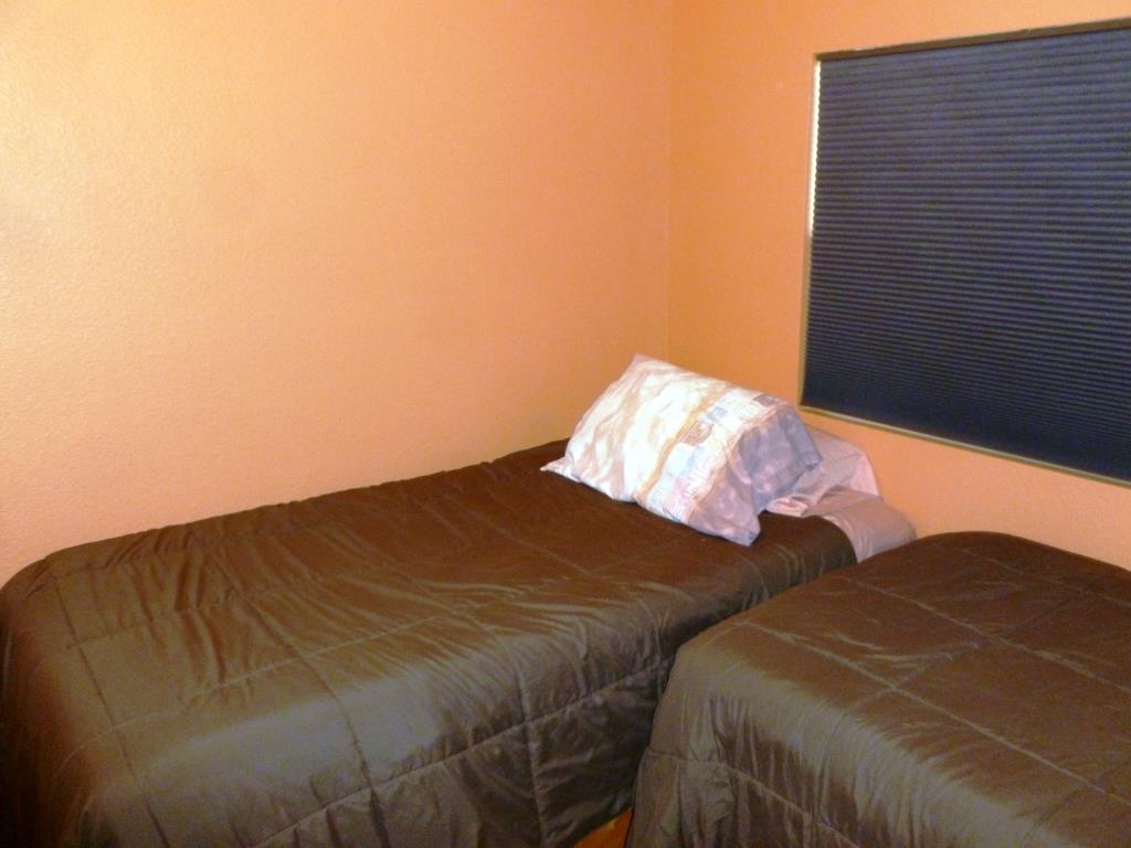 84136 Ave 44, Unit 58 Indio, CA 92203 - Photo 36 of 61 a bed sitting in a bedroom next to a lamp