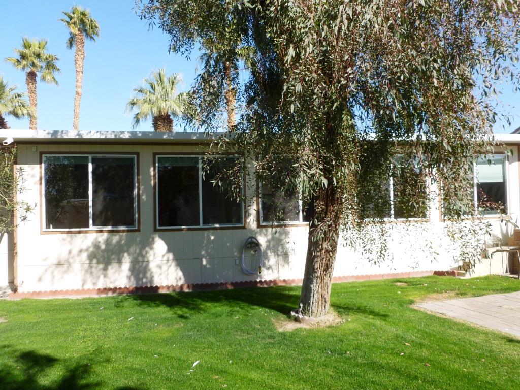 84136 Ave 44, Unit 58 Indio, CA 92203 - Photo 4 of 61 a view of a house with backyard sitting area and garden