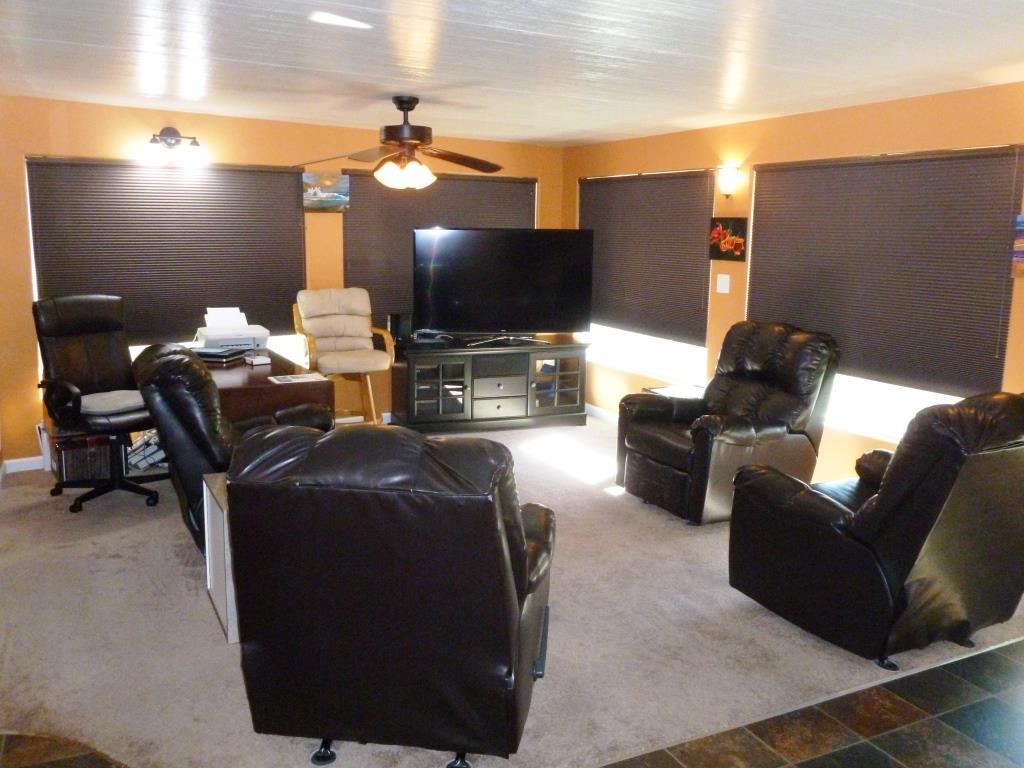 84136 Ave 44, Unit 58 Indio, CA 92203 - Photo 46 of 61 a living room with furniture and a flat screen tv