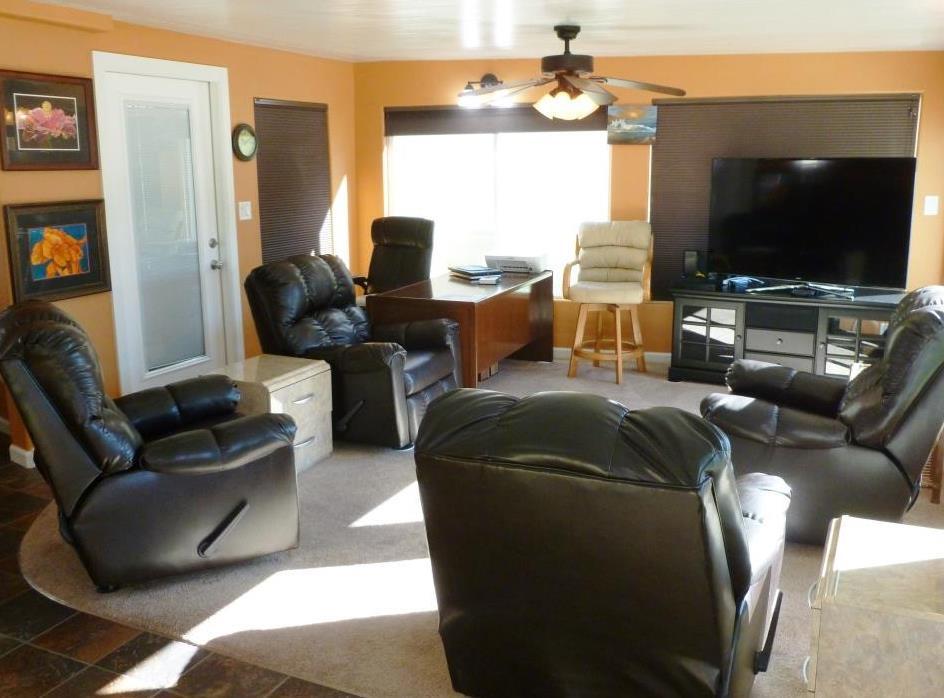 84136 Ave 44, Unit 58 Indio, CA 92203 - Photo 7 of 61 a living room with furniture and a flat screen tv