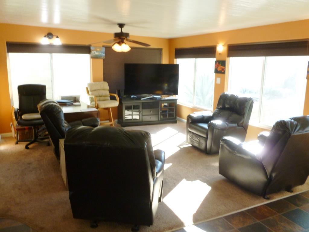 84136 Ave 44, Unit 58 Indio, CA 92203 - Photo 8 of 61 a living room with furniture and a flat screen tv