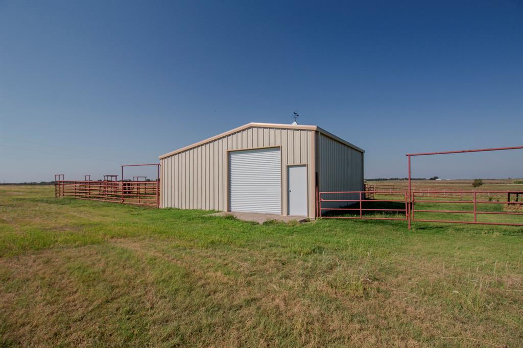 831 Baker Road Tioga, TX 76271 - Photo 17 of 27 a view of a backyard with a garden and entertaining space