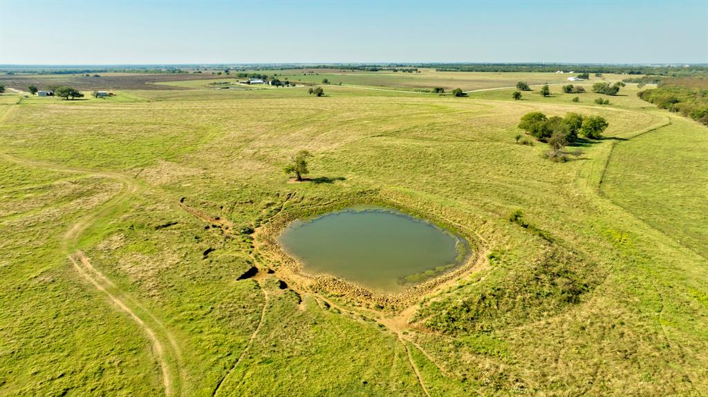 831 Baker Road Tioga, TX 76271 - Photo 24 of 27 a view of a swimming pool and an ocean