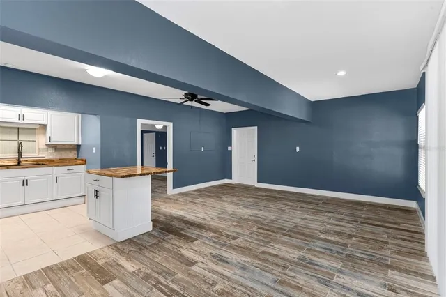 a view of a kitchen cabinets and a wooden floor