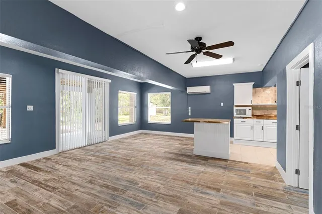 a view of a kitchen with a sink and a window