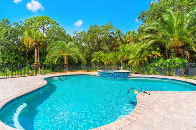 a view of swimming pool with a yard
