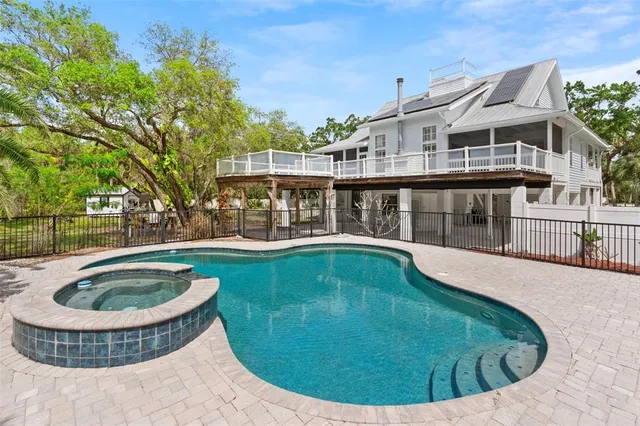 a view of a house with swimming pool
