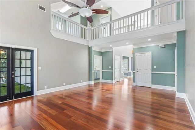 a view of an entryway with wooden floor