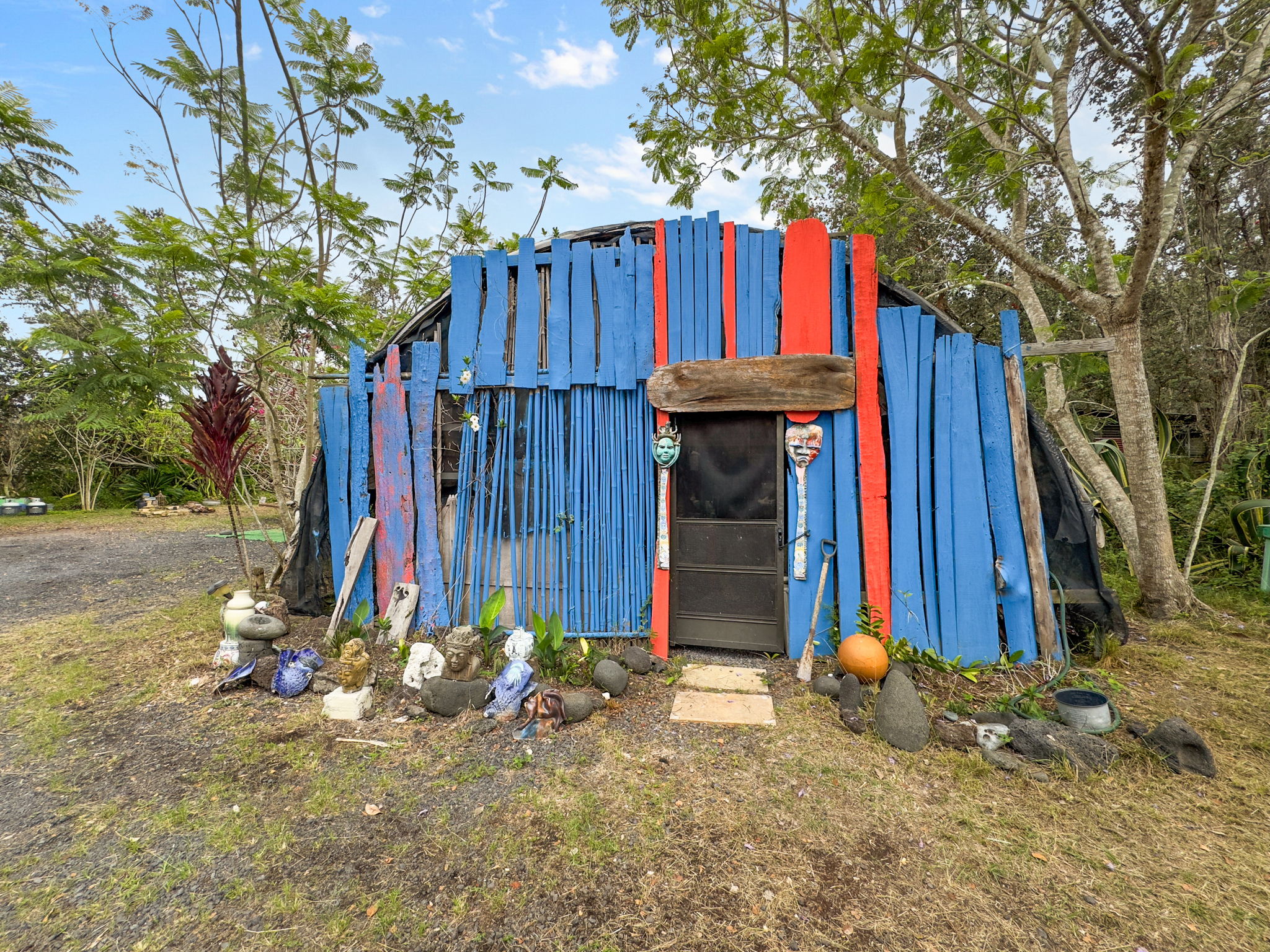 92-1347 Rd To The Sea Ocean View, HI 96704 - Photo 22 of 30 a view of a backyard with a tree