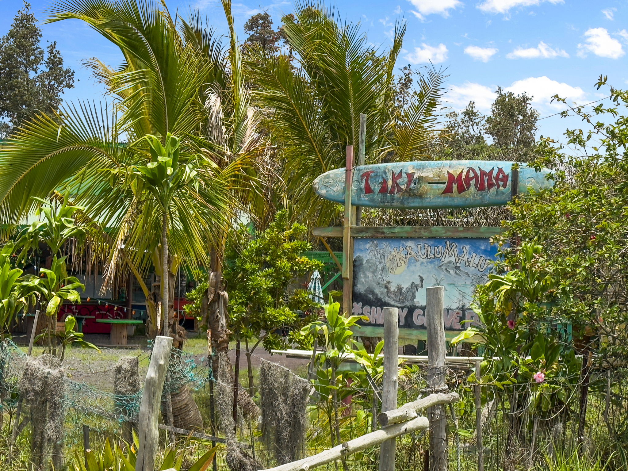 92-1347 Rd To The Sea Ocean View, HI 96704 - Photo 3 of 30 a sign that is sitting on a brick wall