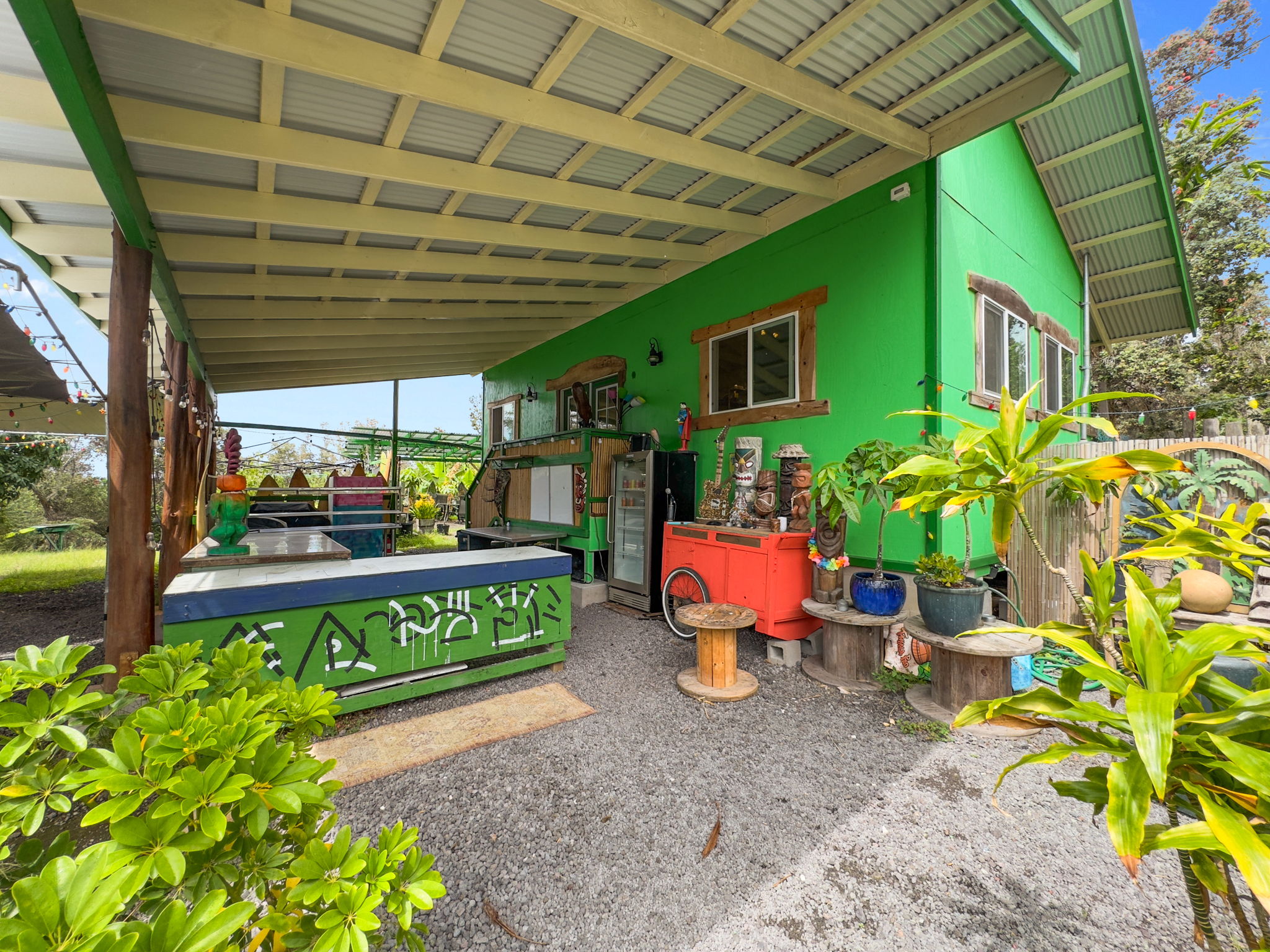 92-1347 Rd To The Sea Ocean View, HI 96704 - Photo 5 of 30 a view of a porch with furniture