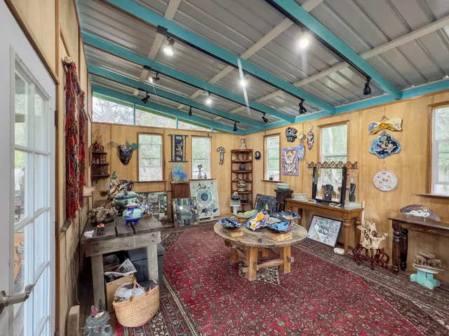 a outdoor room with lots of furniture and a potted plant