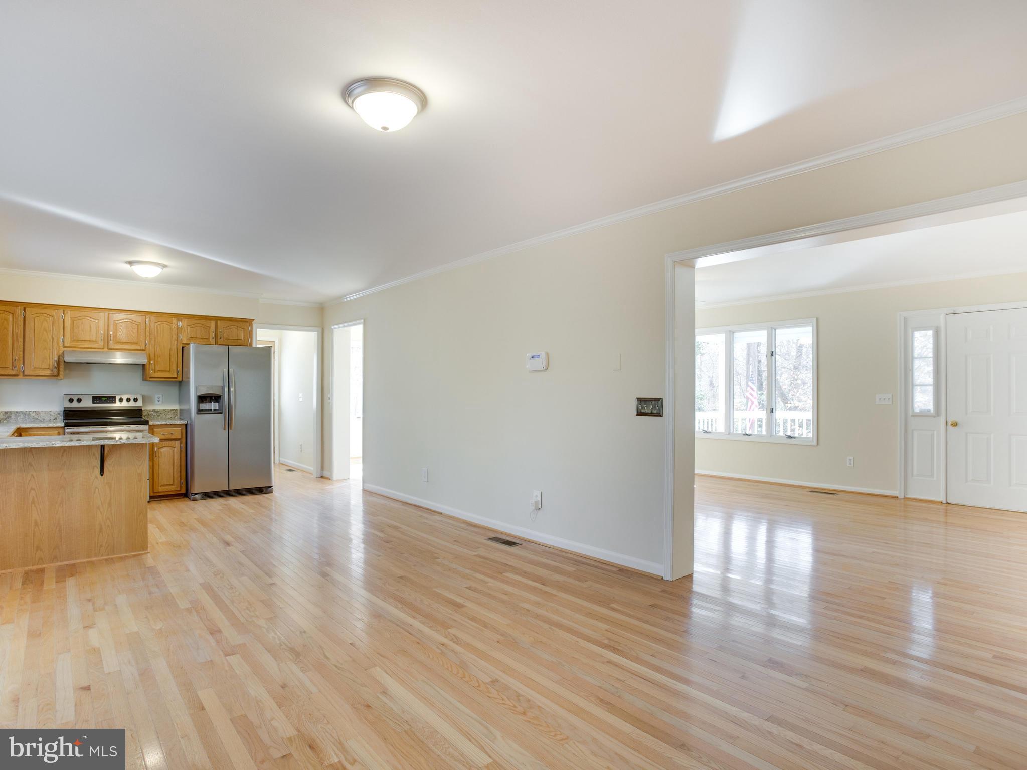 491 Round Up Road Lusby, MD 20657 - Photo 14 of 30 a view of kitchen with stove and wooden floor
