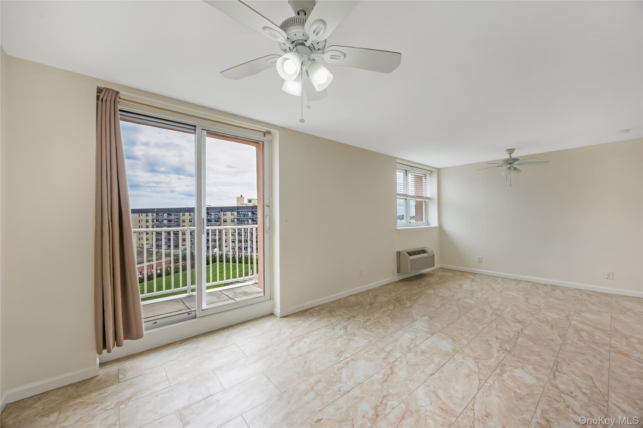 2 Richmond Road, Unit 6M Lido Beach, NY 11561 - Photo 10 of 21 a view of an empty room with a window