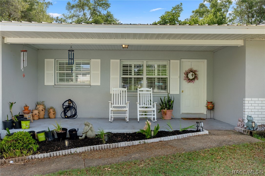 1140 South Highlands Avenue Inverness, FL 34452 - Photo 6 of 54 a front view of a house with a yard