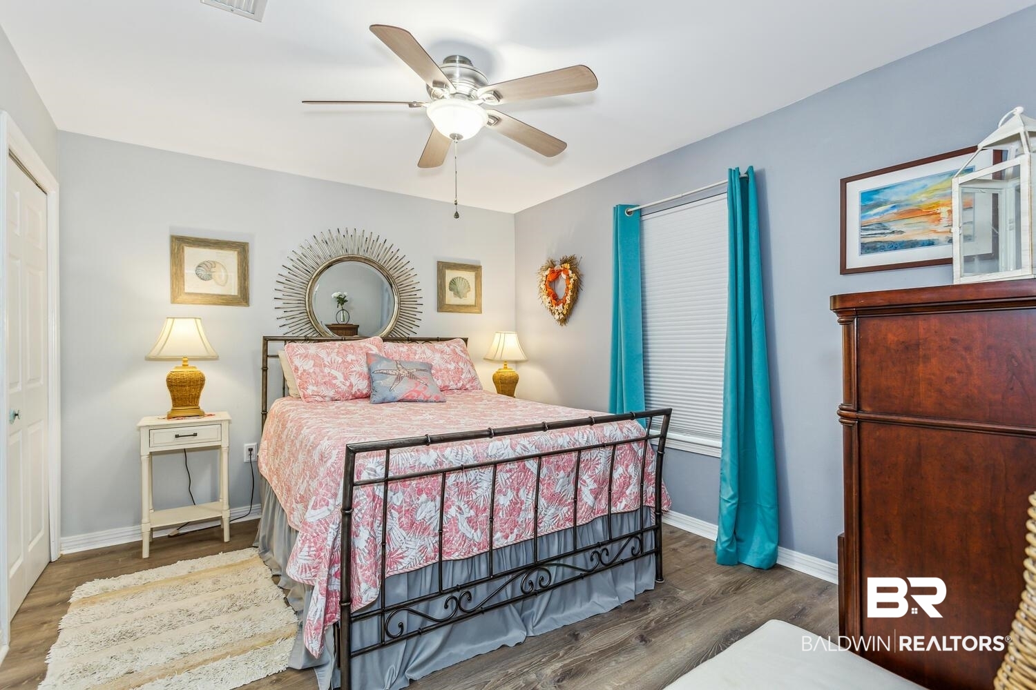 13551 Johnson Beach Road, Unit 112E Pensacola, FL 32507 - Photo 15 of 42 Bedroom with ceiling fan, dark wood-type flooring, and a closet
