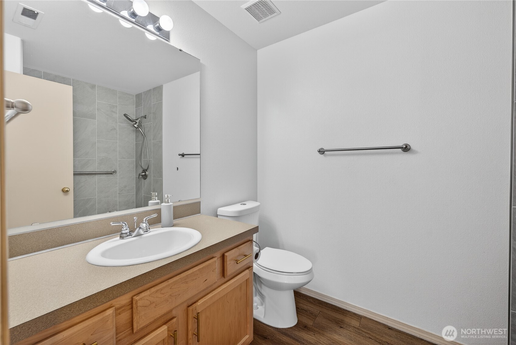 4607 Santa Fe Lane Pasco, WA 99301 - Photo 11 of 28 a bathroom with a sink toilet and a mirror