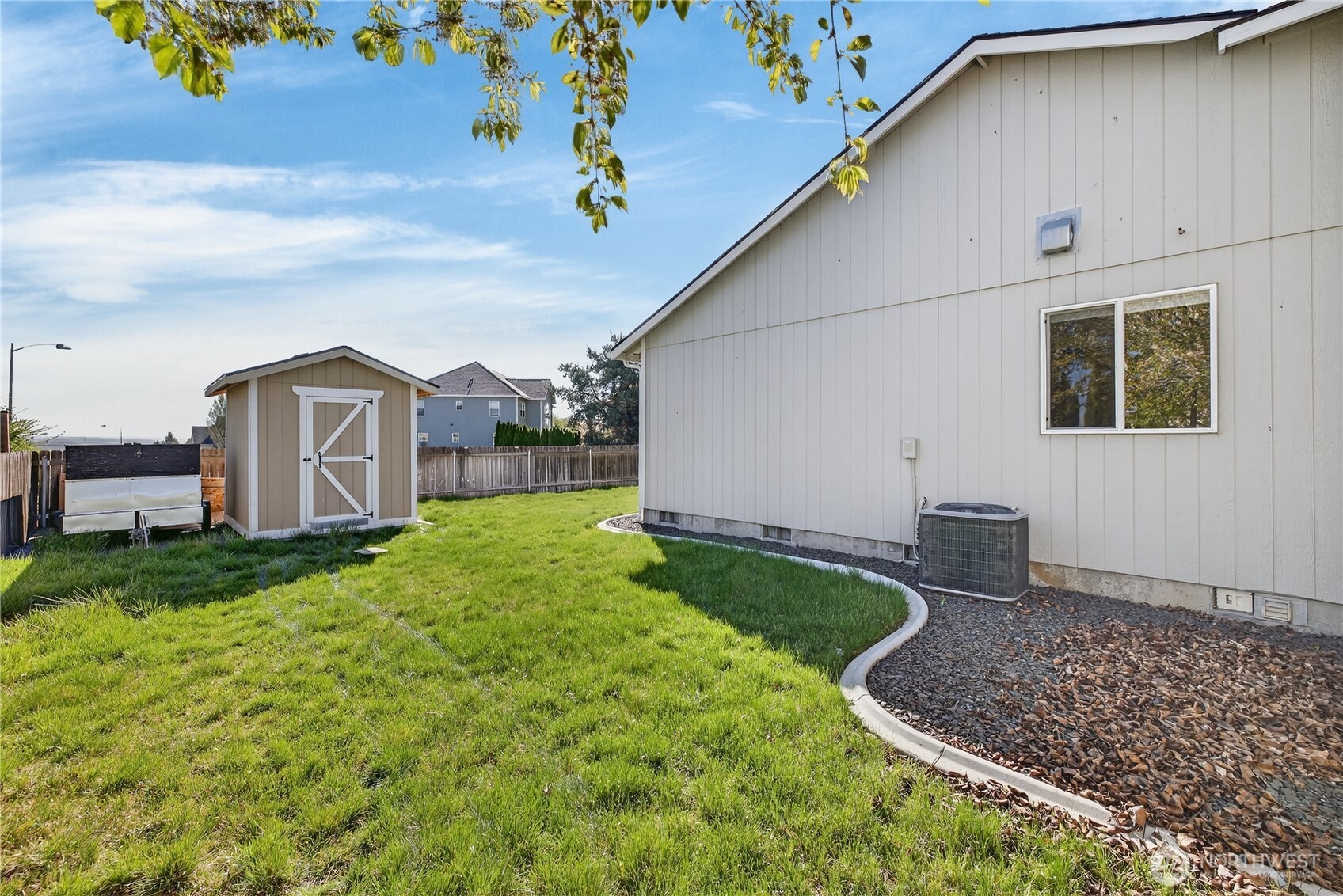 4607 Santa Fe Lane Pasco, WA 99301 - Photo 20 of 28 a house view with a garden space