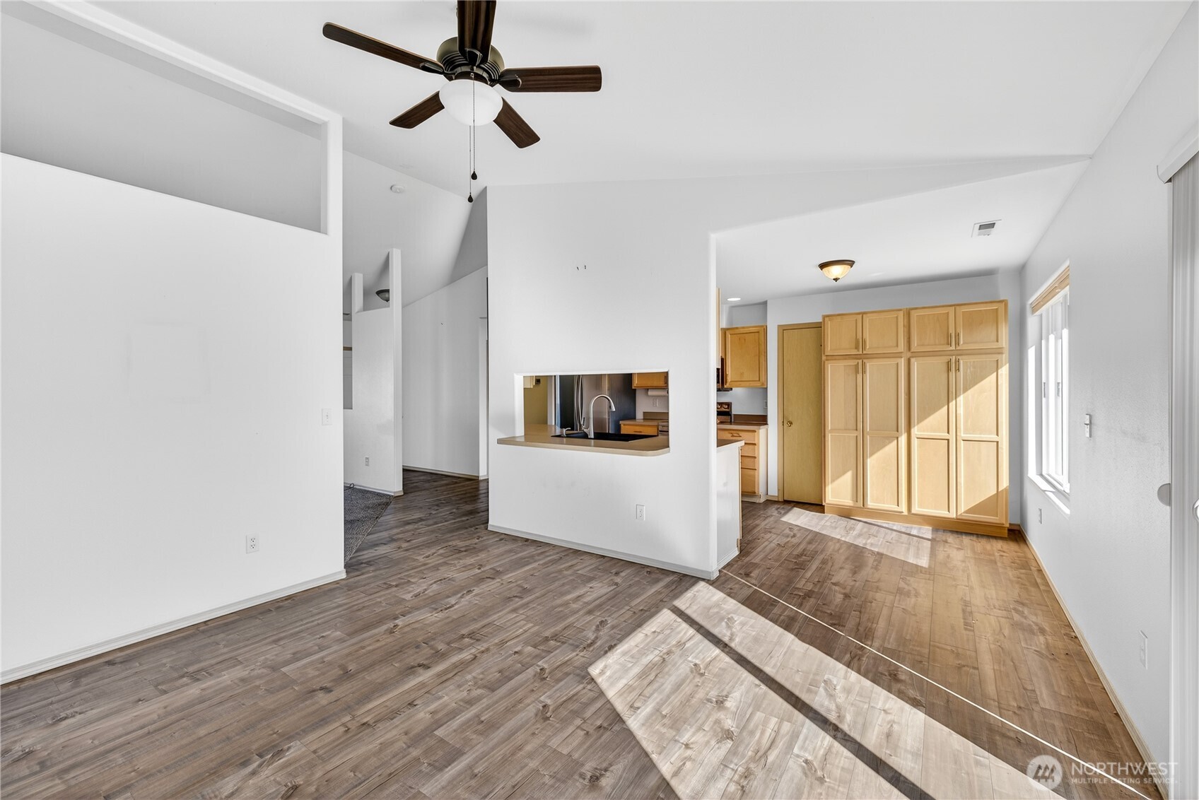 4607 Santa Fe Lane Pasco, WA 99301 - Photo 10 of 28 a living room with a large window and a wooden floor