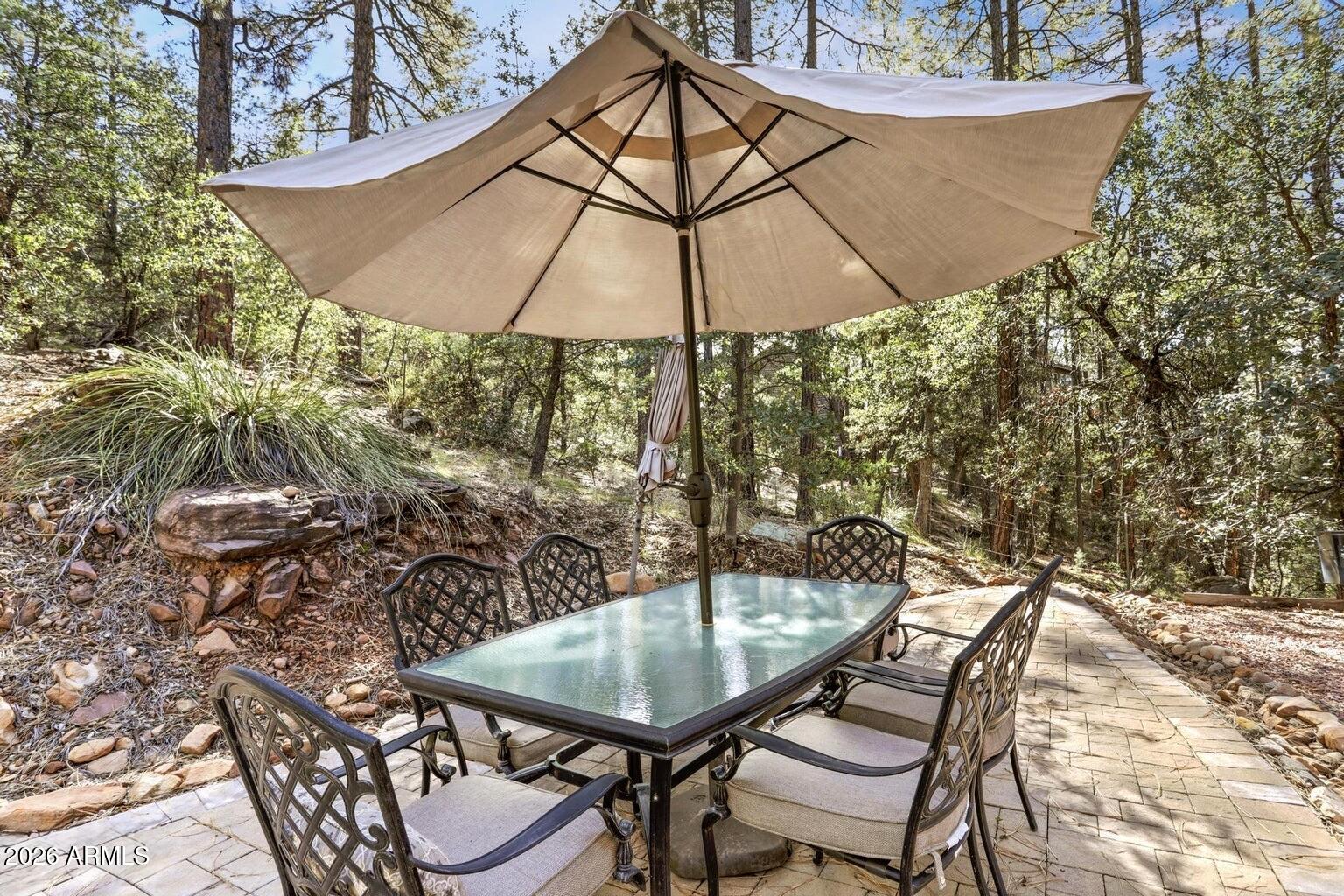 415 East Rim Estates Trail Payson, AZ 85541 - Photo 32 of 76 a backyard of a house with table and chairs