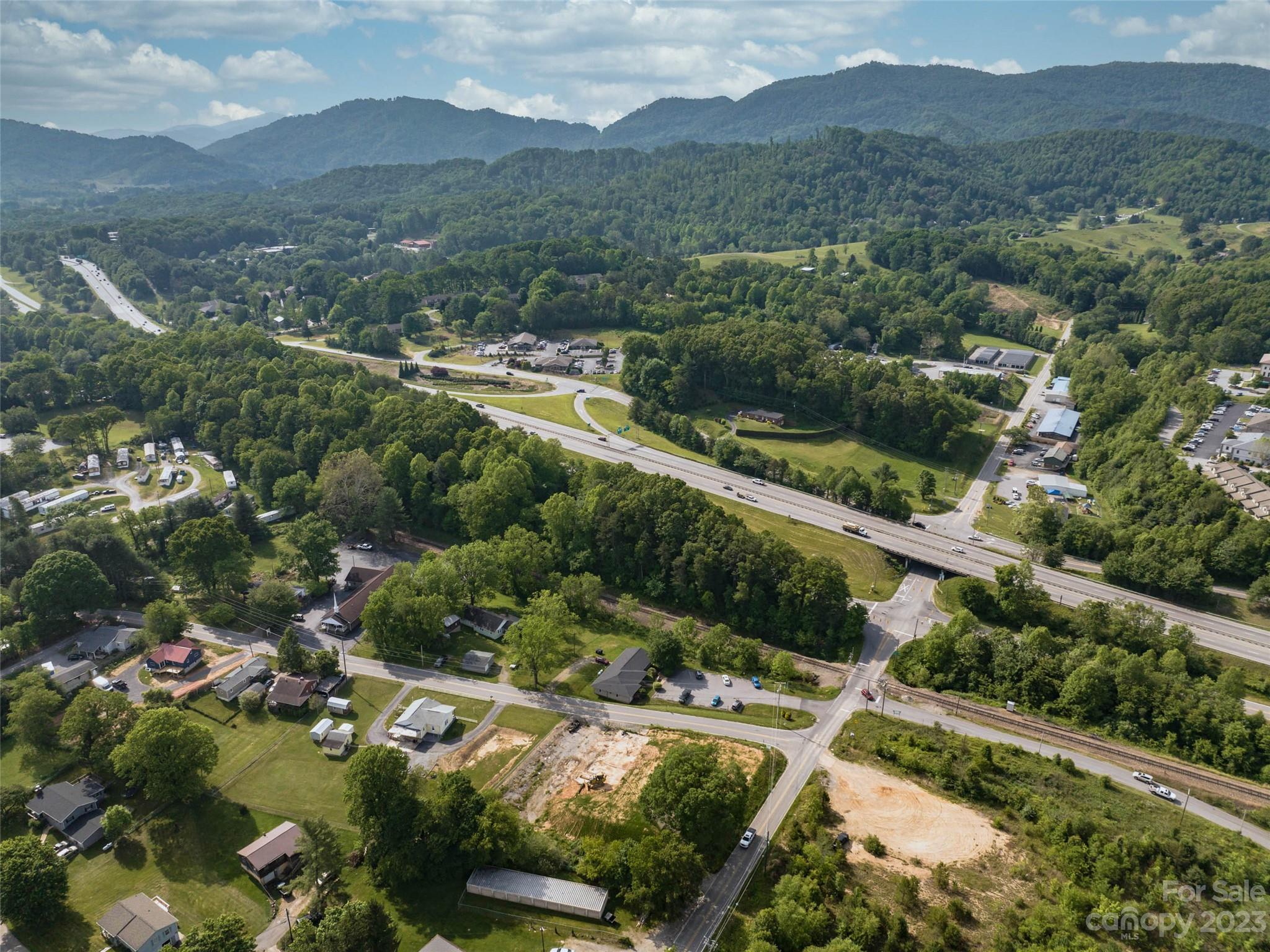 35 Lee Road Clyde, NC 28721 - Photo 3 of 15 an aerial view of residential house with outdoor space and trees all around