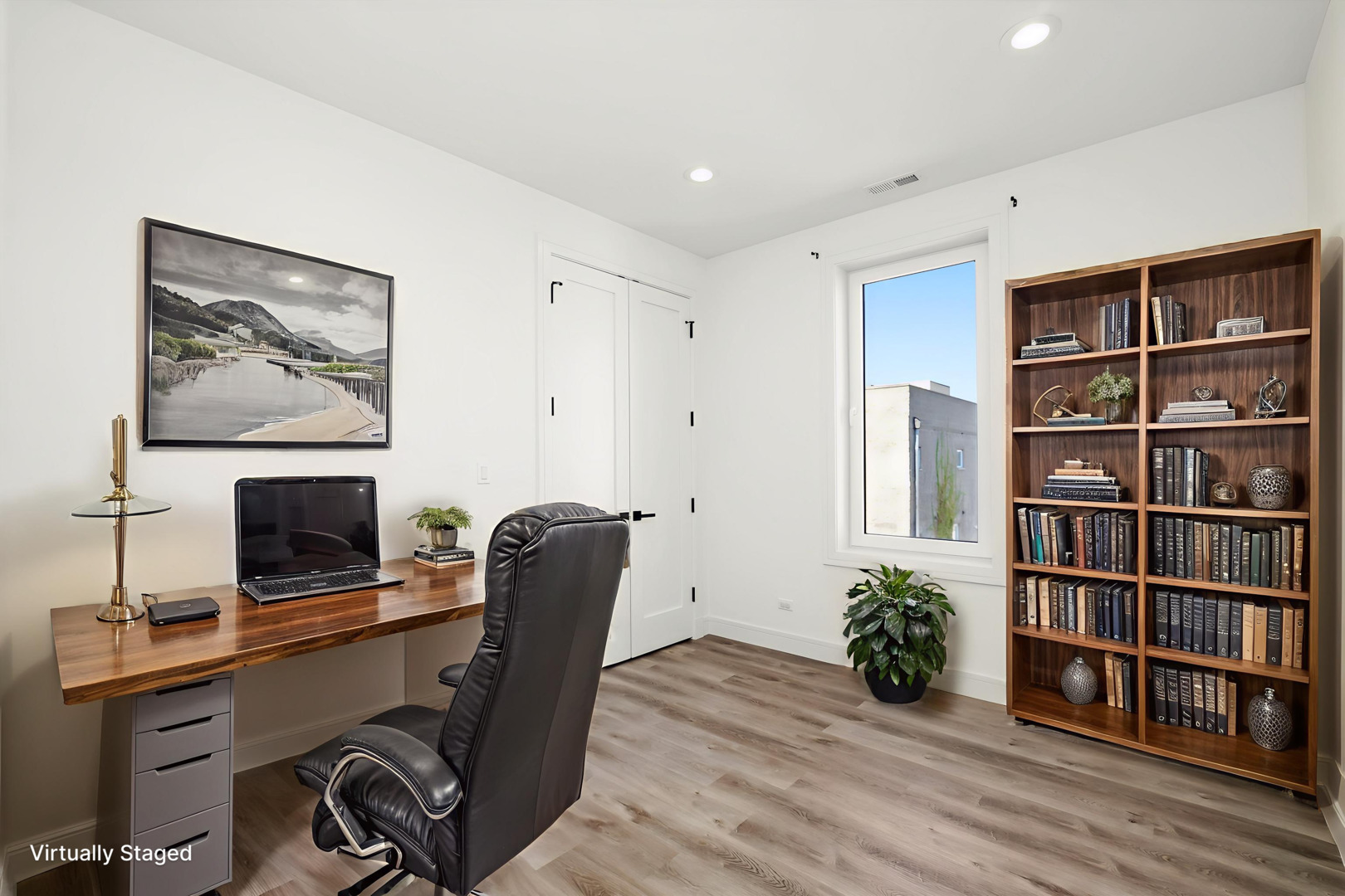 117 South Bell Avenue, Unit 4N Chicago, IL 60612 - Photo 12 of 30 a view of a workspace with furniture and wooden floor
