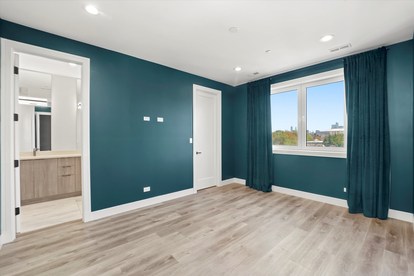 117 South Bell Avenue, Unit 4N Chicago, IL 60612 - Photo 16 of 30 a bedroom with wooden floor and bathroom