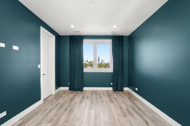 a view of hallway with wooden floor