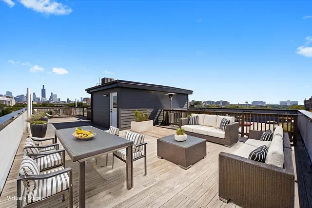 a view of a terrace with couches and potted plants