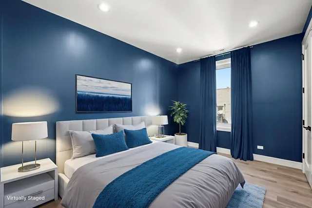 a bedroom with a bed and a lamp