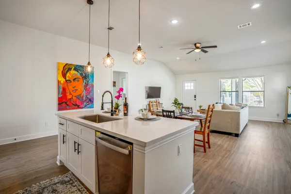 a view of living room with granite countertop furniture and a flat screen tv