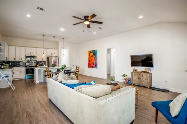 a living room with furniture and a flat screen tv