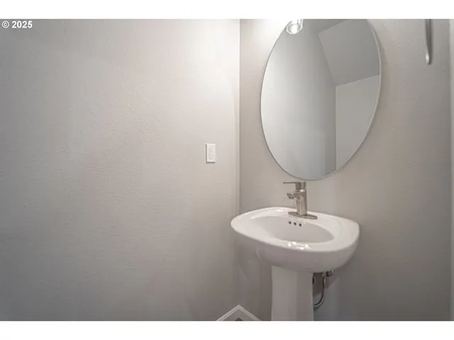 a view of an empty room and a bathroom