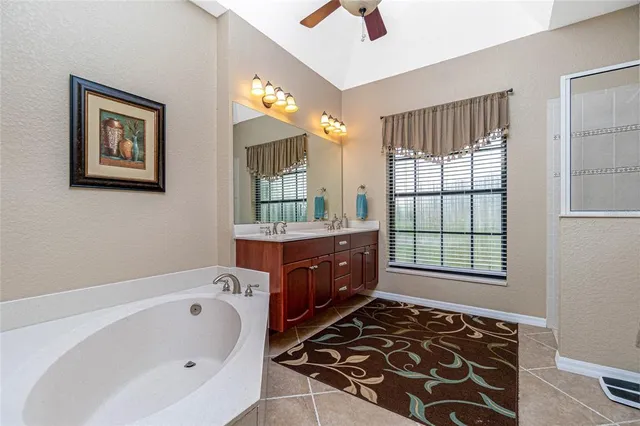 a bathroom with a toilet a sink and a mirror