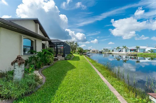a view of a swimming pool with a table and chairs