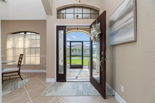 a view of a dining room with furniture and window