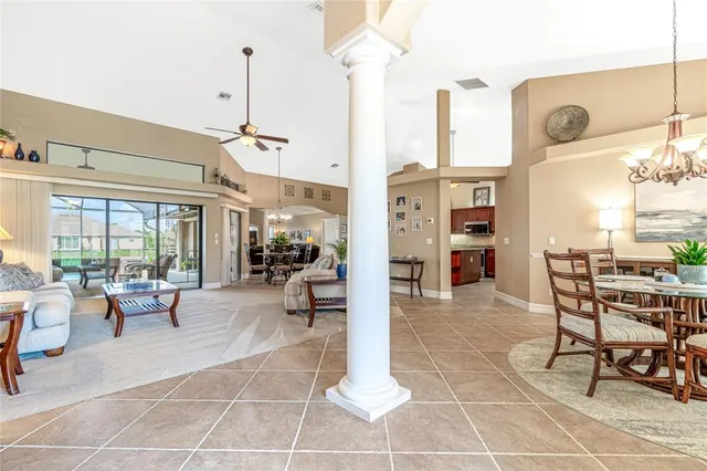 a dining room with furniture and window