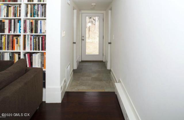 424 Cognewaugh Road Cos Cob, CT 06807 - Photo 17 of 27 a view of a hallway with wooden floor and entryway