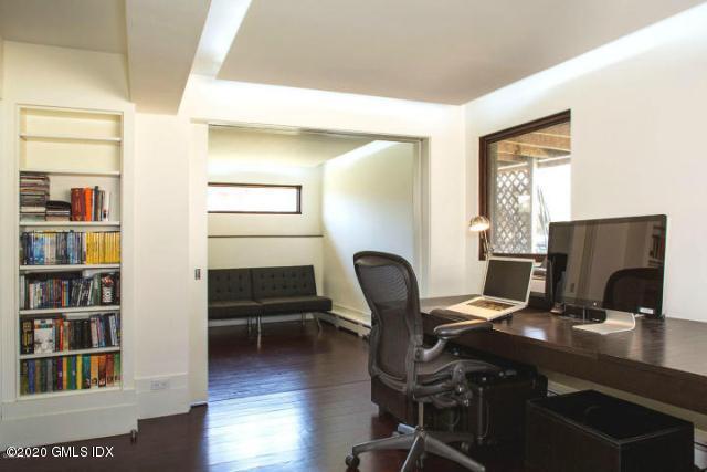 424 Cognewaugh Road Cos Cob, CT 06807 - Photo 18 of 27 a view of a workspace with furniture and a window