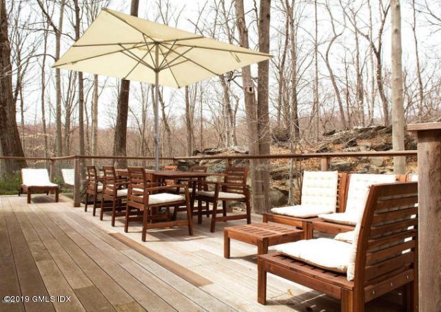 424 Cognewaugh Road Cos Cob, CT 06807 - Photo 23 of 27 a view of a chairs and table on the terrace