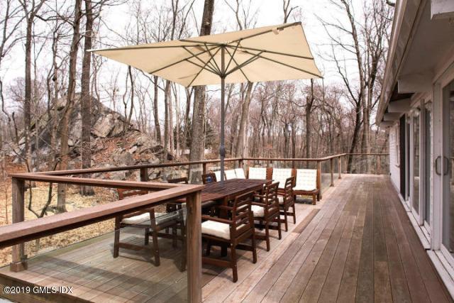424 Cognewaugh Road Cos Cob, CT 06807 - Photo 24 of 27 a view of balcony with wooden floor and outdoor seating